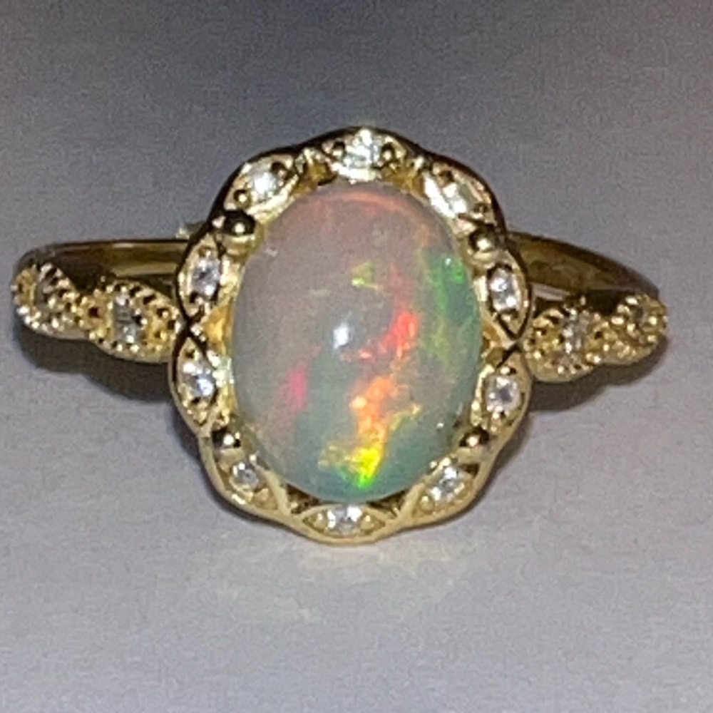 Opal adjustable size ring. Gold plating over sterling silver. NWOT